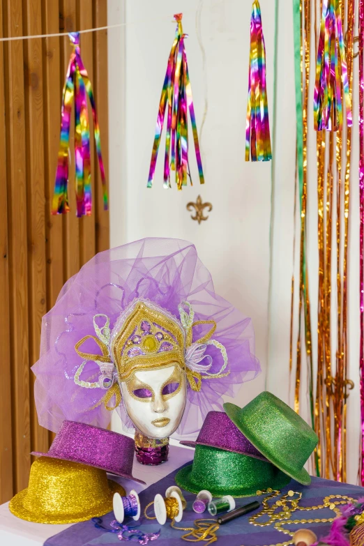 a table set up for a mardi gras party, a portrait, inspired by Bernd Fasching, trending on pexels, renaissance, headpiece, indoor picture, ribbons, glitter