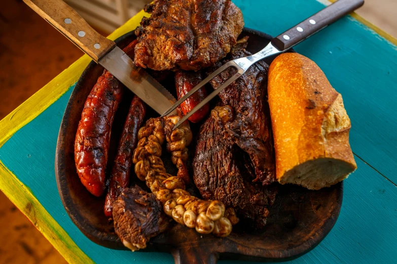 a close up of a plate of food on a table, by Alejandro Obregón, barbecue, thumbnail, group photo