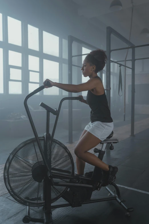 a woman riding an exercise bike in a gym, by Jason Benjamin, dribble, dust mist, ashteroth, ( mechanical ), cooling