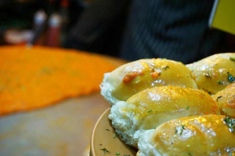 a close up of a plate of food on a table, crispy buns, cheesy, sha xi, square