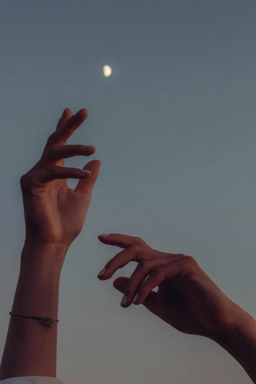 two hands reaching for the moon in the sky, trending on unsplash, aestheticism, portrait photo, late summer evening, ignant, also known as artemis the selene