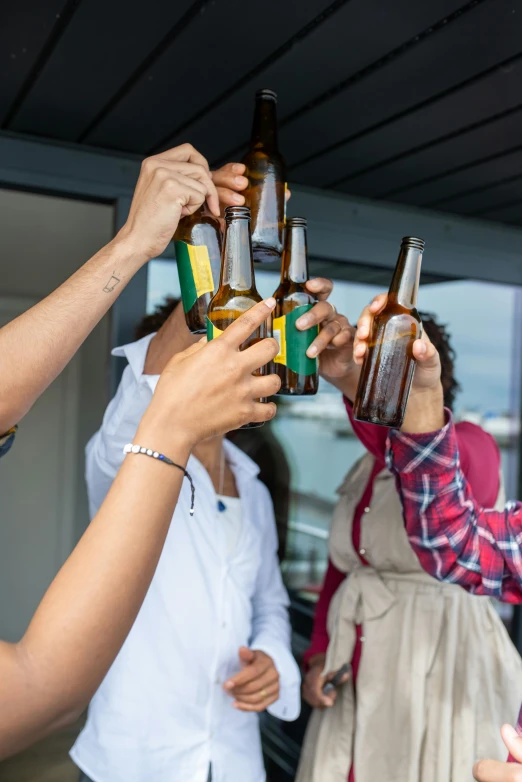 a group of people toasting with beer bottles, pexels contest winner, renaissance, on ship, college, new zealand, but minimalist