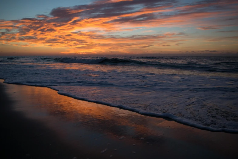 the sun is setting over the ocean on the beach, by Gwen Barnard, unsplash contest winner, hurufiyya, rippling reflections, today\'s featured photograph 4k, goodnight, ignant