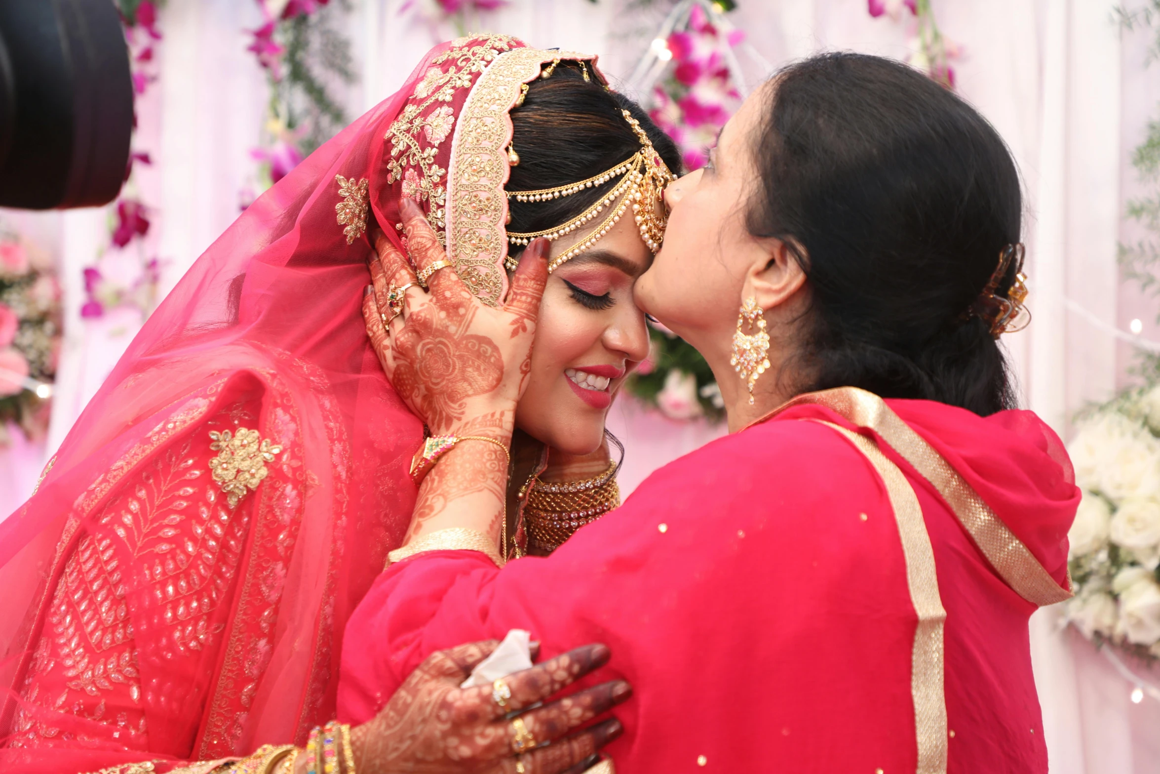 a couple of women standing next to each other, pexels, hurufiyya, ceremony, kissing together cutely, indian, youtube thumbnail