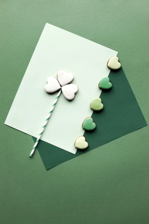 a st patrick's day card on a green background, a picture, trending on pexels, conceptual art, sweets, minimalissimo, asset on grey background, hearts