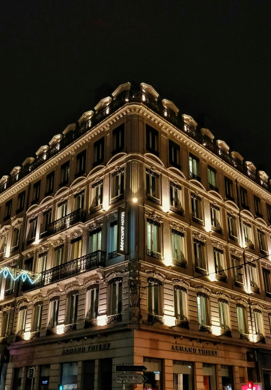 a very tall building lit up at night, inspired by Albert Paris Gütersloh, unsplash, art nouveau, hotel room, naples, square, profile image
