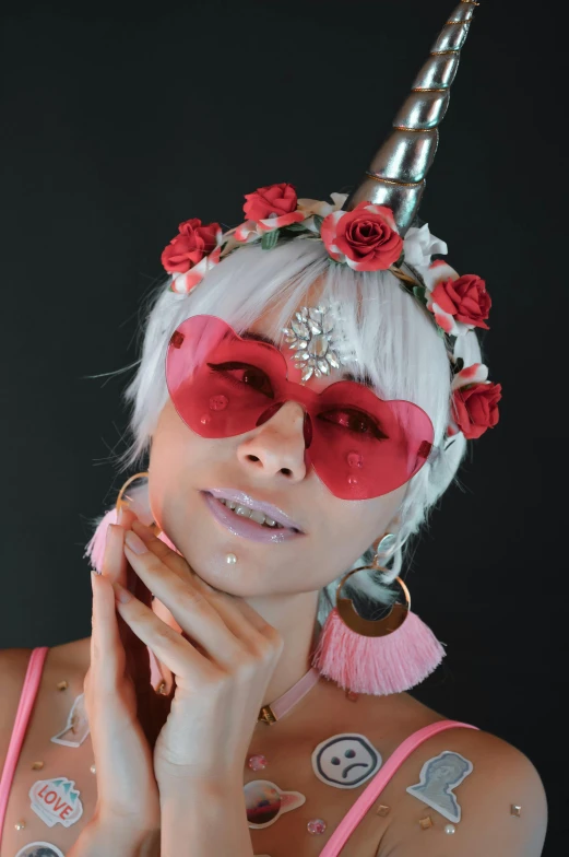 a woman with a unicorn horn on her head, inspired by Karl Hagedopoorn, trending on pexels, woman with rose tinted glasses, white bangs, for hire 3d artist, red colored