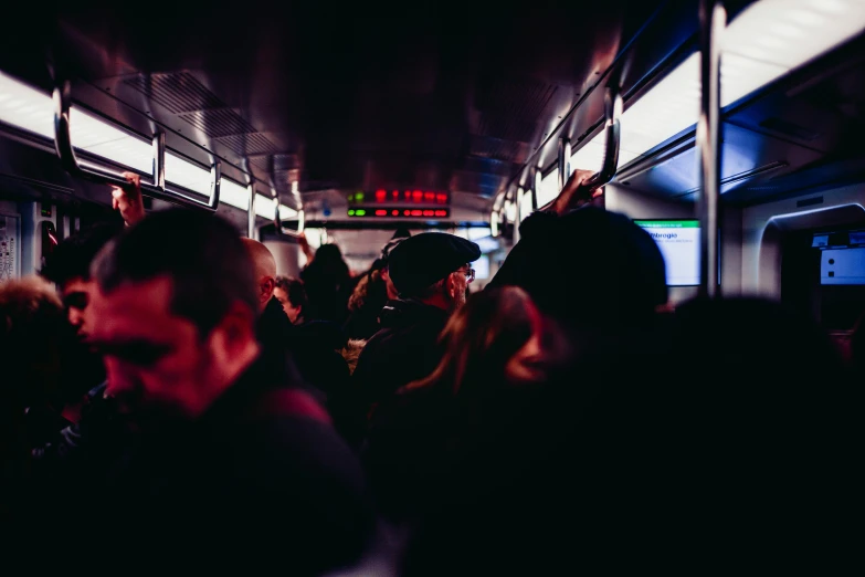 a group of people standing next to each other on a subway, pexels, happening, at a rave, it's getting dark, 2 5 6 x 2 5 6 pixels, buses