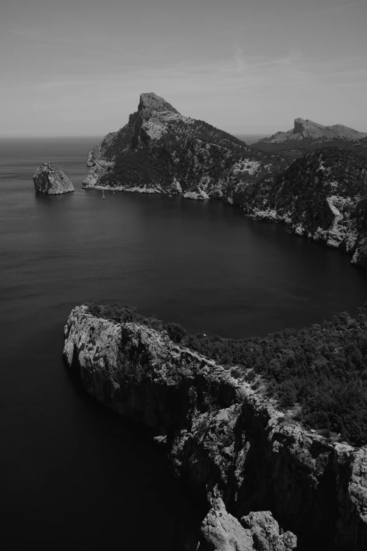 a black and white photo of a large body of water, a black and white photo, by Matteo Pérez, pexels contest winner, 2 5 6 x 2 5 6 pixels, ibiza, peaks, aerial footage