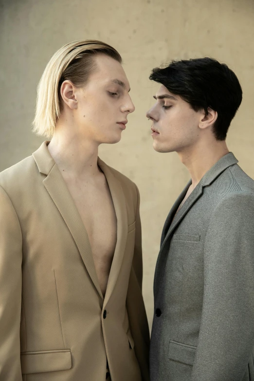 a couple of men standing next to each other, unsplash, bauhaus, delicate androgynous prince, alexey egorov, body and headshot, tan suit