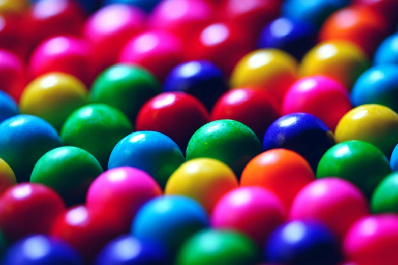 a close up of a bunch of colorful balls, by Joe Bowler, candy treatments, colour corrected, 2 5 6 x 2 5 6 pixels, chocolate