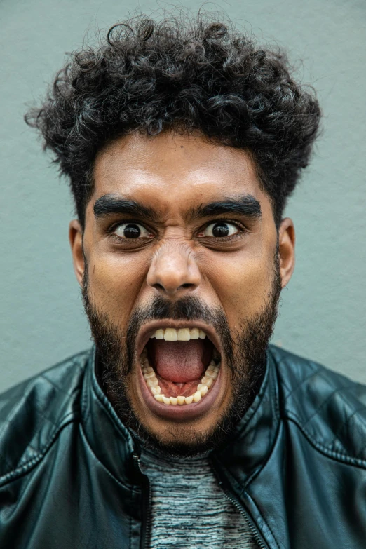 a close up of a person with an open mouth, trending on pexels, aboriginal australian hipster, mad man screaming, scowling, curls on top of his head