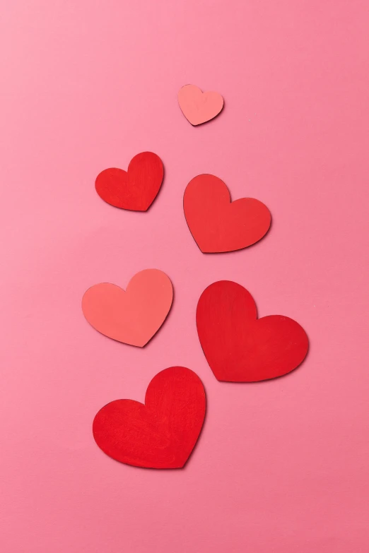 red and pink paper hearts on a pink background, jen atkin, commercially ready, single file, visuals