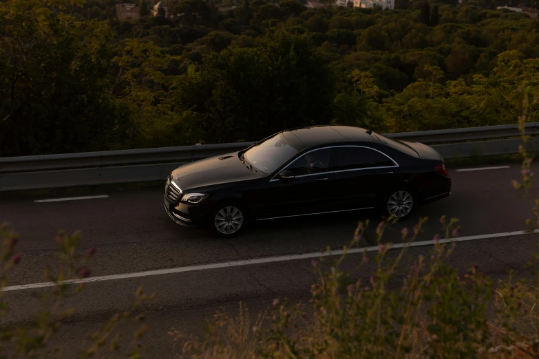 a car that is sitting on the side of a road, by Carlo Martini, pexels contest winner, figuration libre, mercedez benz, beautifully soft lit, traveling in france, low quality photo