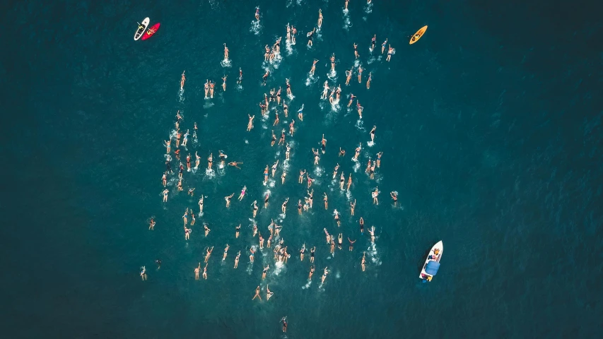 a group of people swimming in the ocean, by Matija Jama, unsplash contest winner, figuration libre, some boats, ironman, aerial illustration, 1980s photo