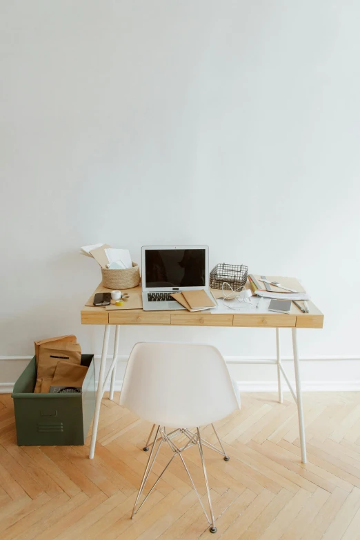 a laptop computer sitting on top of a wooden desk, dwell, curated collection, 9 9 designs, sterile minimalistic room
