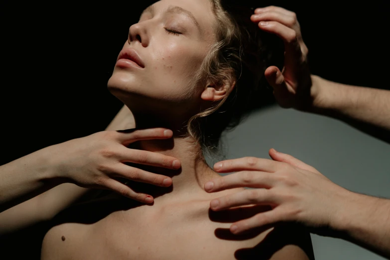 a close up of a person touching a woman's neck, trending on pexels, hyperrealism, floating bodies, luminous body, multiple limbs, resting on chest