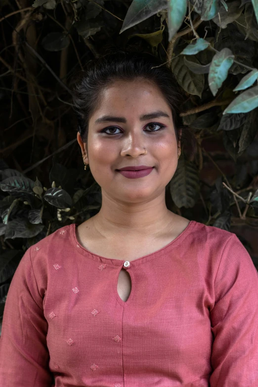 a woman in a pink dress posing for a picture, by Sunil Das, headshot profile picture, promo image, multiple stories, student