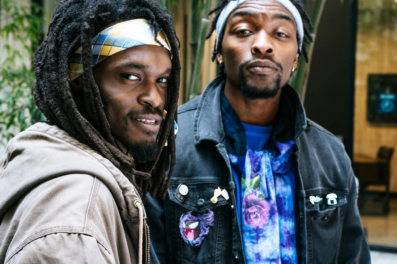 a couple of men standing next to each other, a portrait, inspired by Ras Akyem, unsplash, black arts movement, dreads, snoop dogg doctor strange, photograph of three ravers, lostus flowers