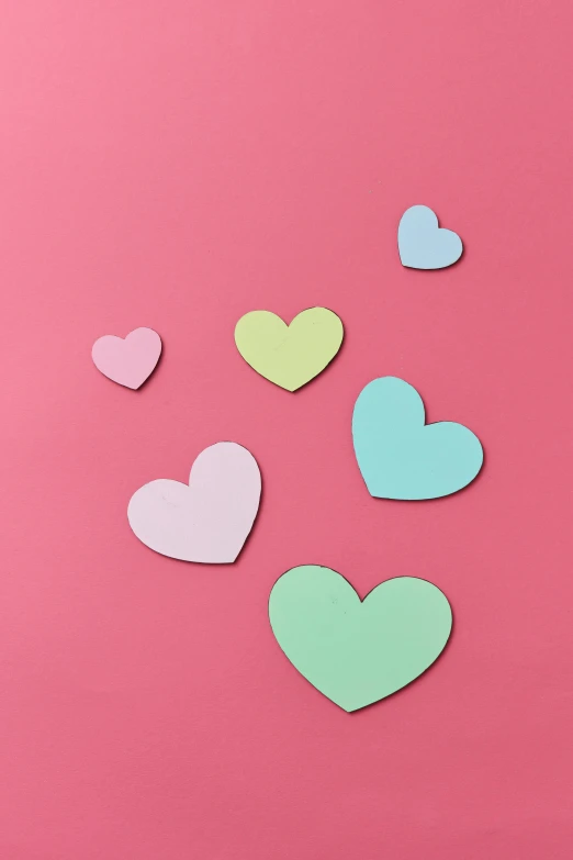 a bunch of paper hearts on a pink background, inspired by Peter Alexander Hay, teal studio backdrop, 8, item, cake