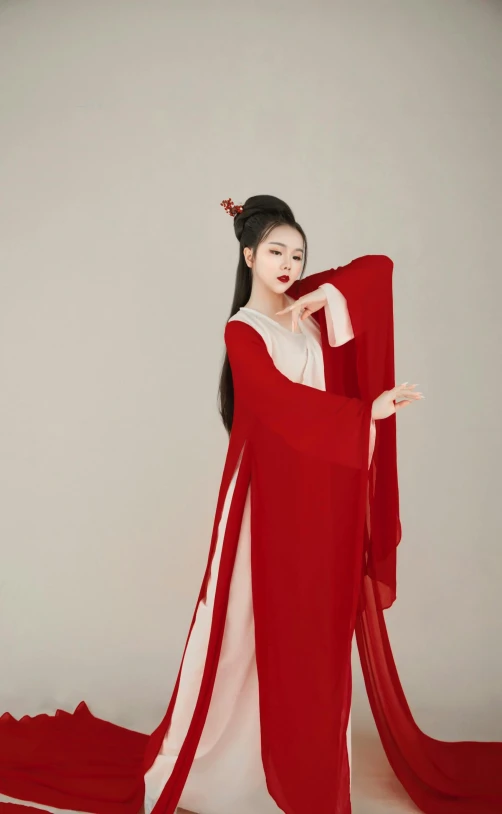 a woman in a red dress posing for a picture, an album cover, inspired by Tang Di, trending on pexels, white hanfu, ( ( theatrical ) ), promotional image, 1 4 8 0 s