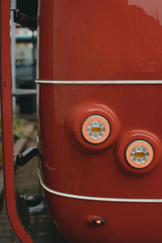 a red bus parked on the side of the road, by David Donaldson, trending on unsplash, tactile buttons and lights, detail face, round doors, hoog detail