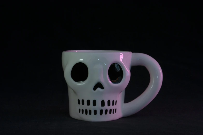 a close up of a cup with a skull on it, a 3D render, unsplash, yume nikki, full front view, white muzzle and underside, late night