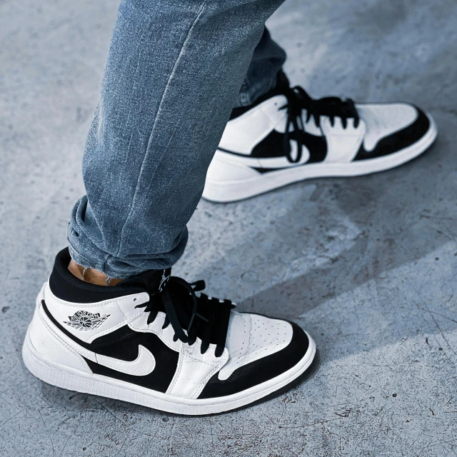 a close up of a person standing on a skateboard, air jordan 1 high, white and black, low profile, highly stylized