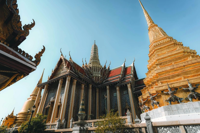 a group of people standing in front of a building, thai architecture, gold and green, anor londo, highly upvoted