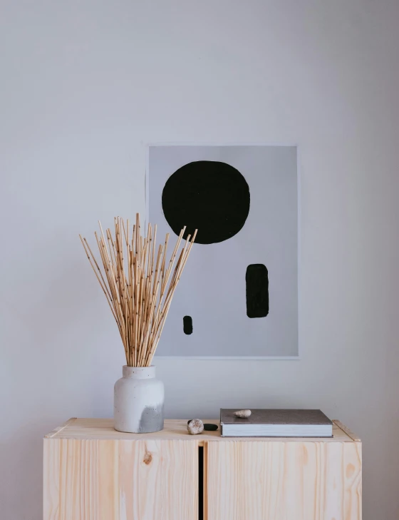 a white vase sitting on top of a wooden cabinet, a minimalist painting, inspired by Josse Lieferinxe, unsplash, reeds, jpeg artefacts on canvas, advertisement poster, concrete art style