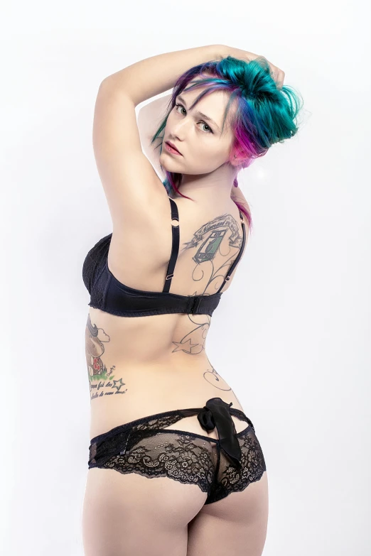a woman with colorful hair posing for a picture, a tattoo, inspired by Jessie Alexandra Dick, in a black betch bra, lingerie!!, coloured photo, black underwear