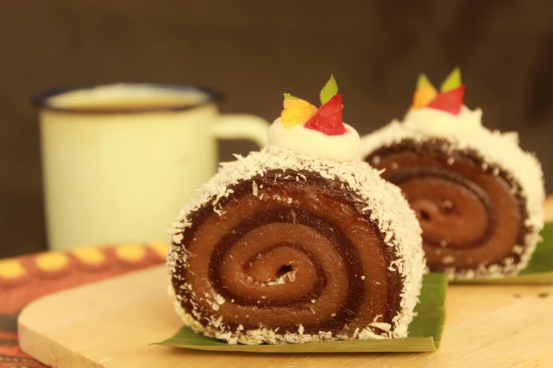 a pastry sitting on top of a cutting board next to a cup of coffee, inspired by Károly Patkó, hurufiyya, candy forest, promo image, indonesia, eyes rolled back