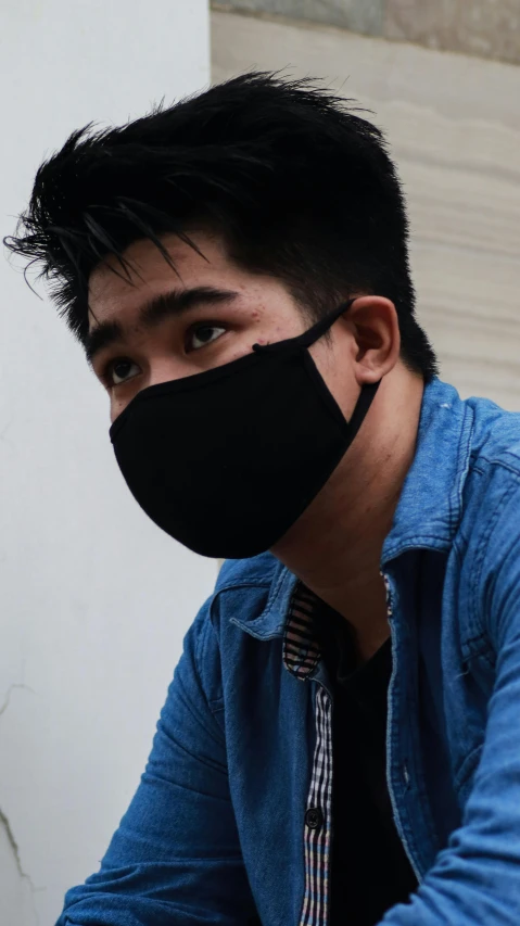 a man in a blue shirt and a black face mask, pexels contest winner, realism, young cute wan asian face, jakarta, vantablack gi, wearing black