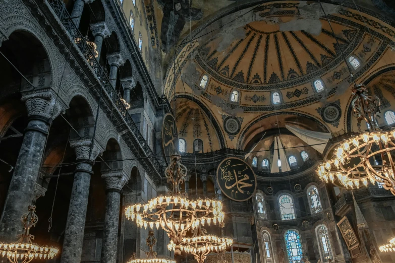 a group of chandeliers hanging from the ceiling of a building, a colorized photo, pexels contest winner, with great domes and arches, turkey, grey, byzantine mosaic