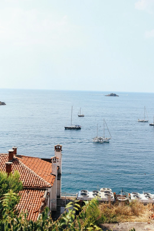a group of boats floating on top of a body of water, a picture, pexels contest winner, renaissance, monaco, low quality photo, square, croatian coastline