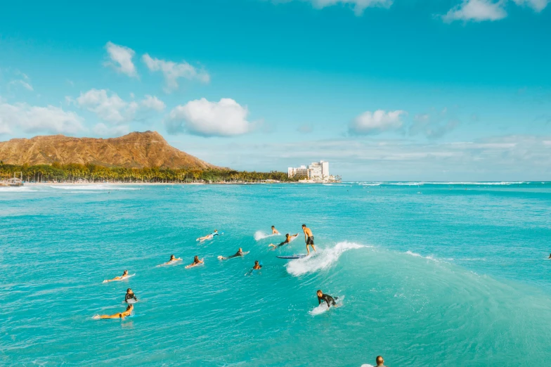 a group of people riding surfboards on top of a wave, waikiki beach, crystal clear blue water, teal aesthetic, mango