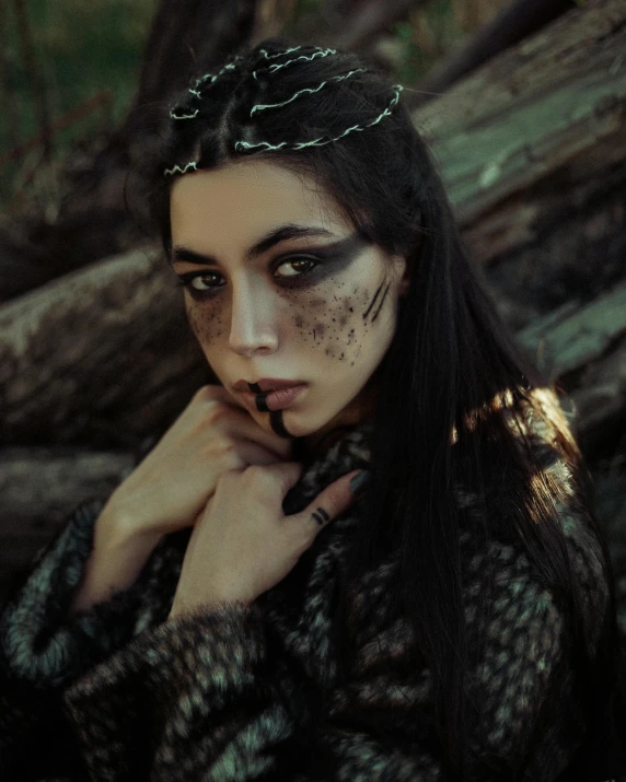 a woman with makeup and a crown on her head, trending on pexels, gothic art, postapocalyptic style, wood elf, grainy, wild black hair