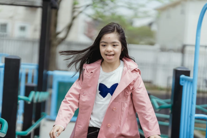 a little girl riding a skateboard on a playground, inspired by Kim Jeong-hui, pexels contest winner, american barbizon school, she is wearing a wet coat, headshot, humans of new york, youtube thumbnail