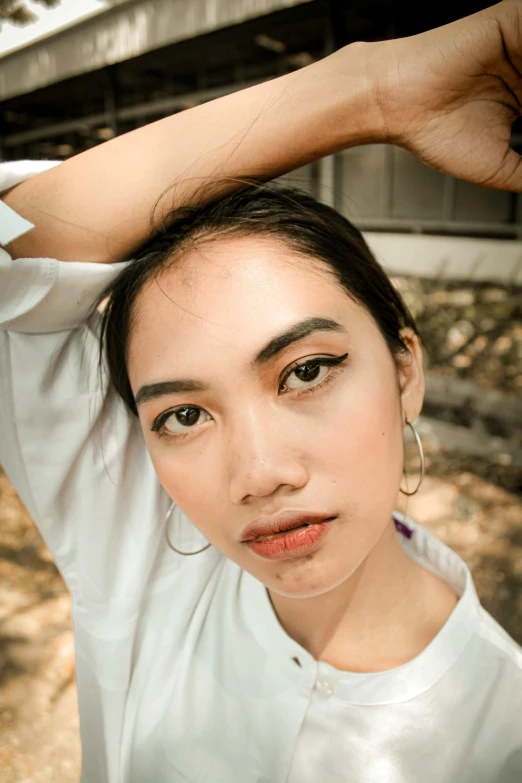 a close up of a person holding a toothbrush, inspired by Ruth Jên, trending on pexels, photorealism, asian beautiful face, portrait androgynous girl, square face, south east asian with long