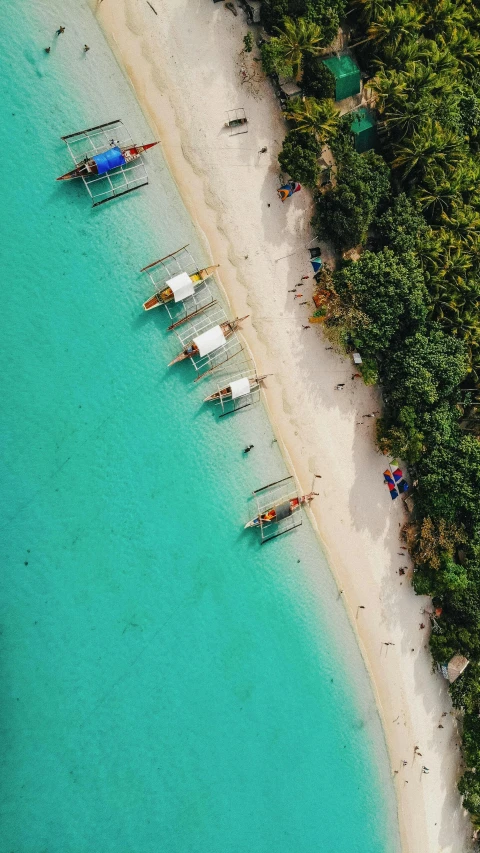 a group of boats sitting on top of a sandy beach, a screenshot, pexels contest winner, philippines, airplane view, teal aesthetic, thumbnail