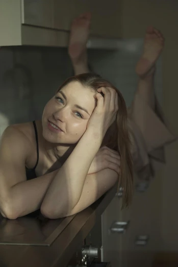 a beautiful young woman laying on top of a kitchen counter, by Elizabeth Polunin, pexels contest winner, renaissance, admiring her own reflection, soft light.4k, natalie dormer, portrait of a ballerina