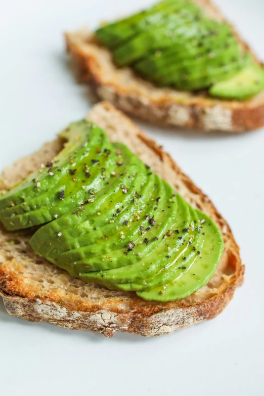 two slices of bread with avocado on them, dwell, say ahh, highly_detailded, 0