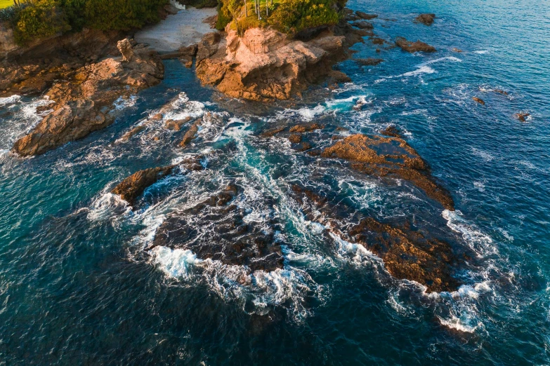 a small island in the middle of the ocean, pexels contest winner, process art, waves crashing at rocks, wide aerial shot, british columbia, quixel megascans