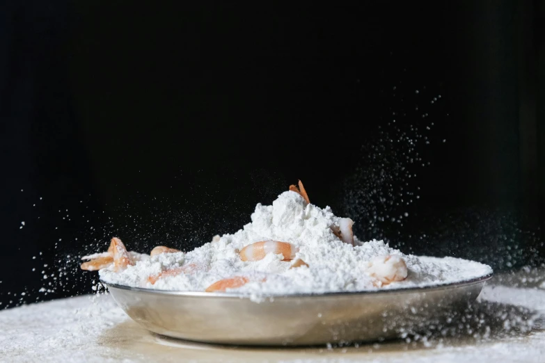 a bowl of food sitting on top of a table, trending on unsplash, process art, flour dust flying, shrimp, white and orange breastplate, modeled