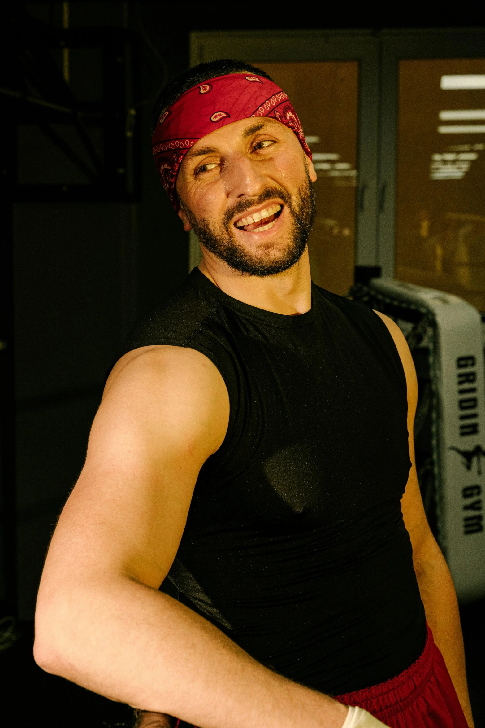 a man that is standing up with a frisbee, inspired by Volkan Baga, smiling spartan, in a gym, head shoot, hybrid human/tank