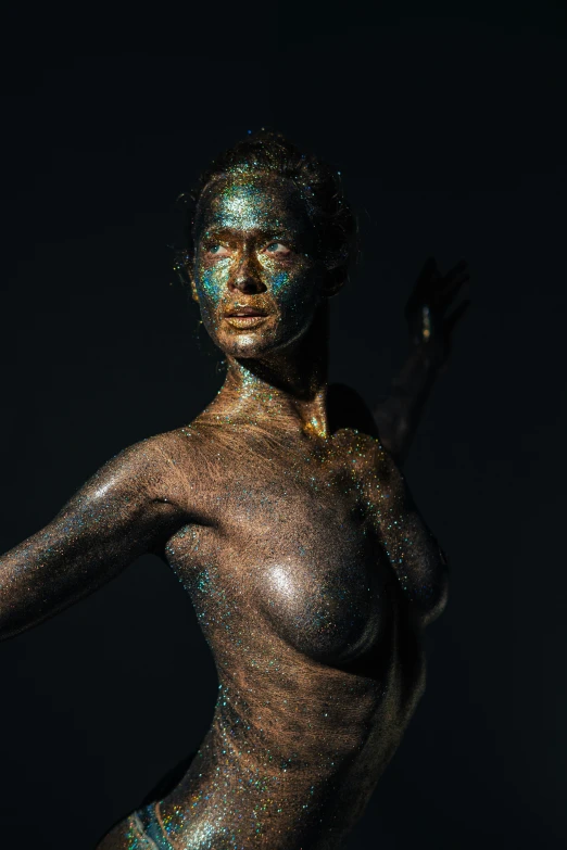 a statue of a woman with blue paint on her body, a bronze sculpture, inspired by Hedi Xandt, unsplash contest winner, brown skin like soil, vivid studio light, dirty gold, portrait of eva green