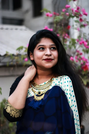 a woman in a blue sari posing for a picture, an album cover, pexels contest winner, white + blue + gold + black, at college, facebook profile picture, wearing a blouse