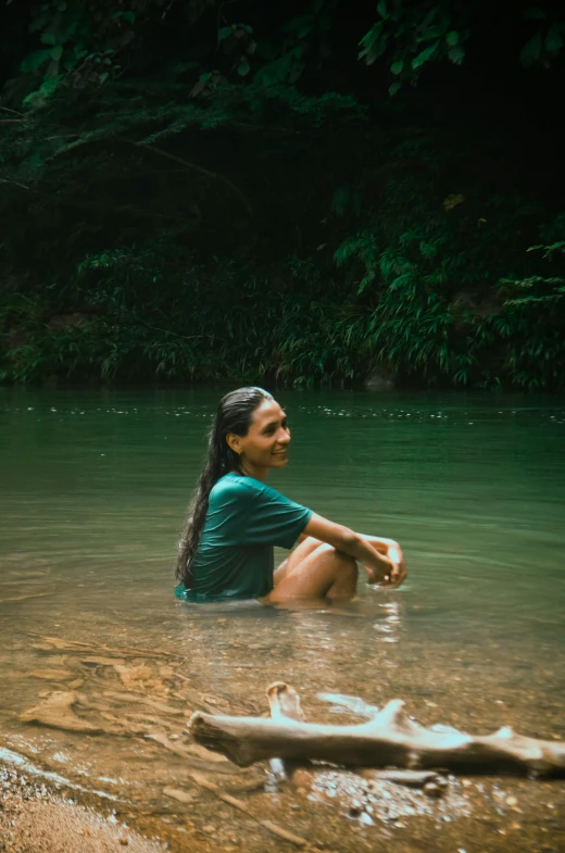 a woman sitting in a body of water, sumatraism, lush green, camaraderie, instagram post, puerto rico