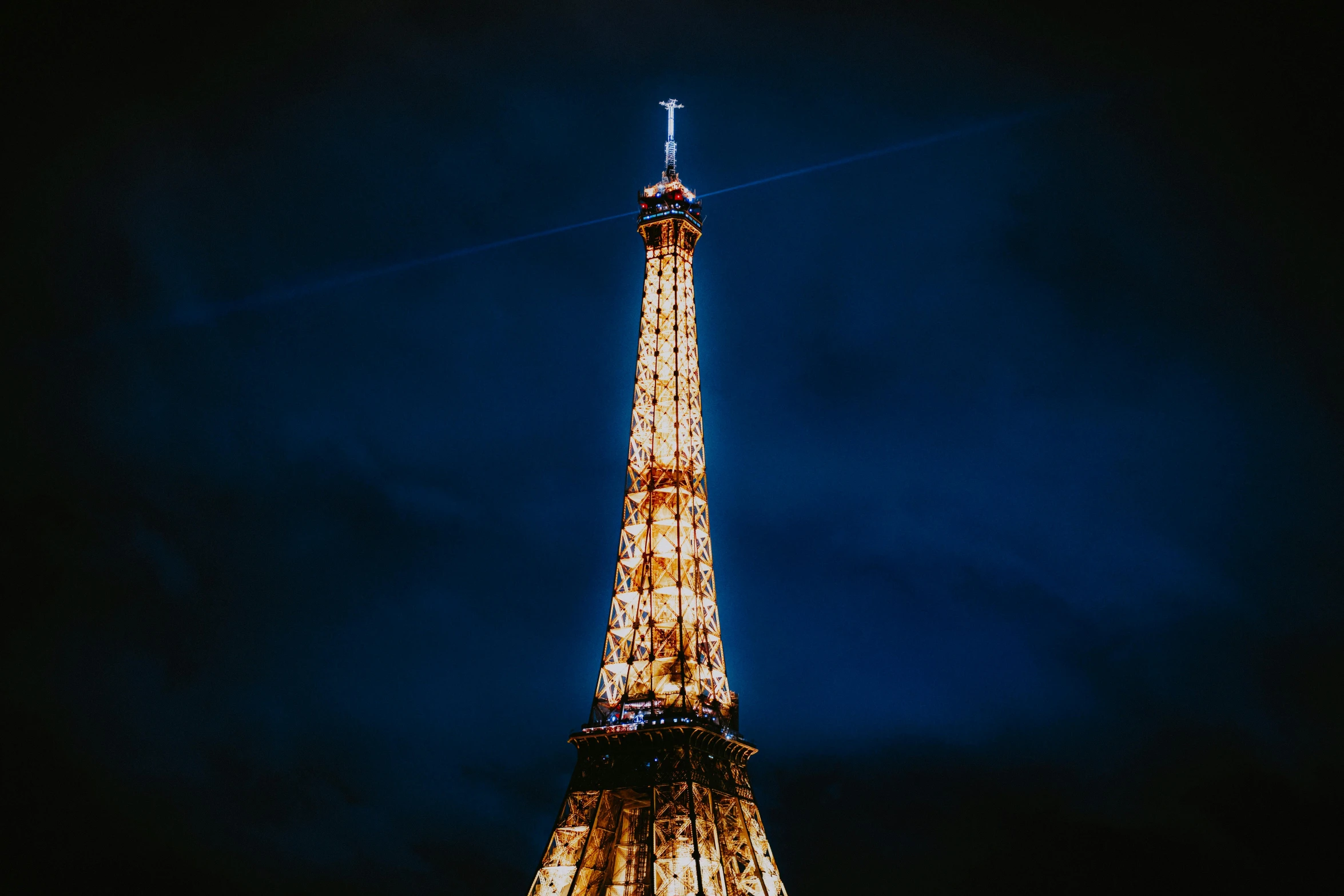 the eiffel tower is lit up at night, unsplash contest winner, visual art, tall thin build, brown, single light, low detailed