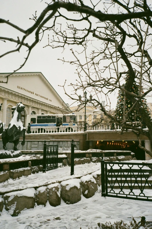 a train is coming down the tracks in the snow, inspired by Vasily Surikov, exterior botanical garden, marketsquare, sleipnir, seen from outside